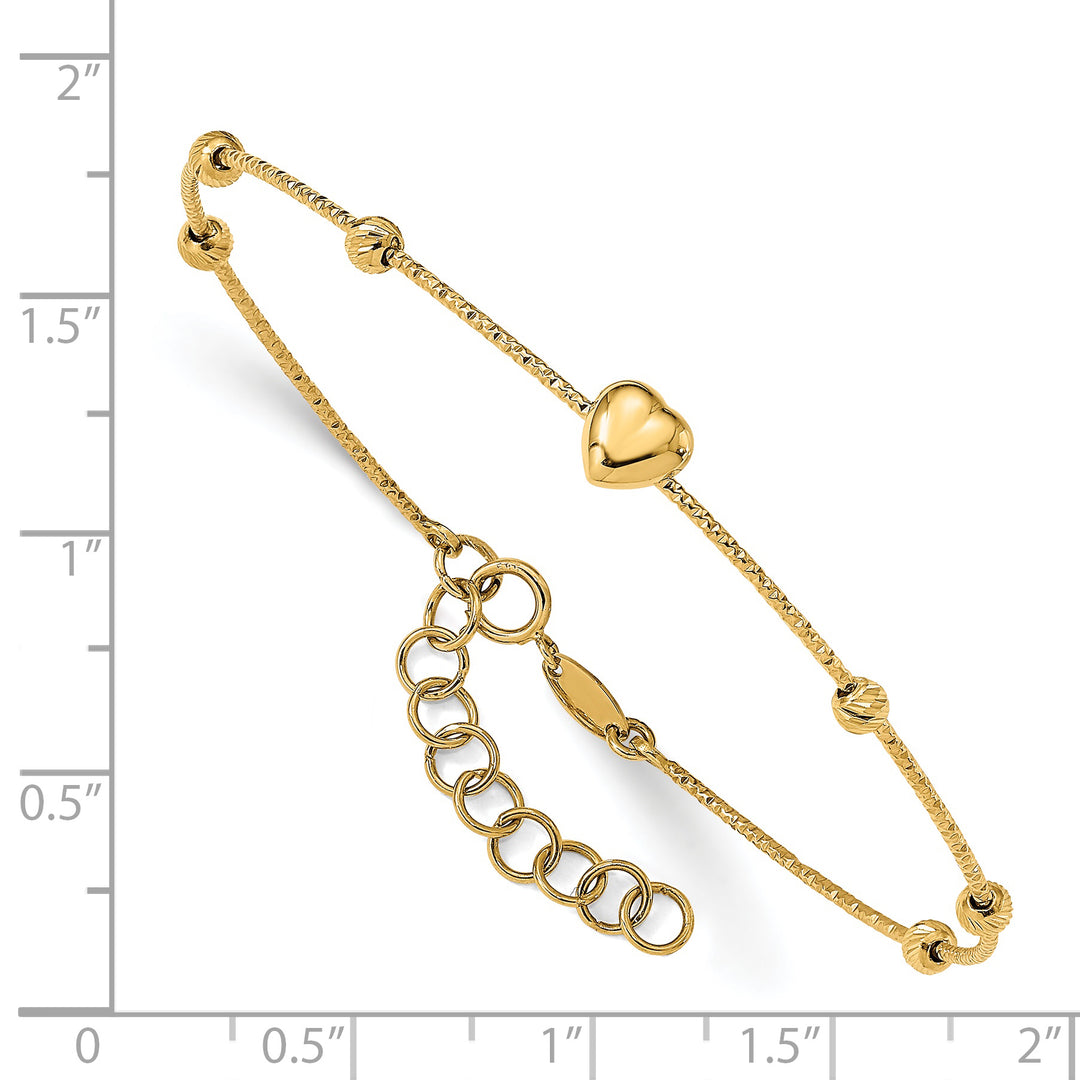 Pulsera Bangle Flexible con Corazón y Bolitas en Corte Diamante con Extensor de 1 pulgada en Oro Amarillo de 14kCuentas D/C de 14K con corazón con extensión de 1 pulgada. Brazalete flexible