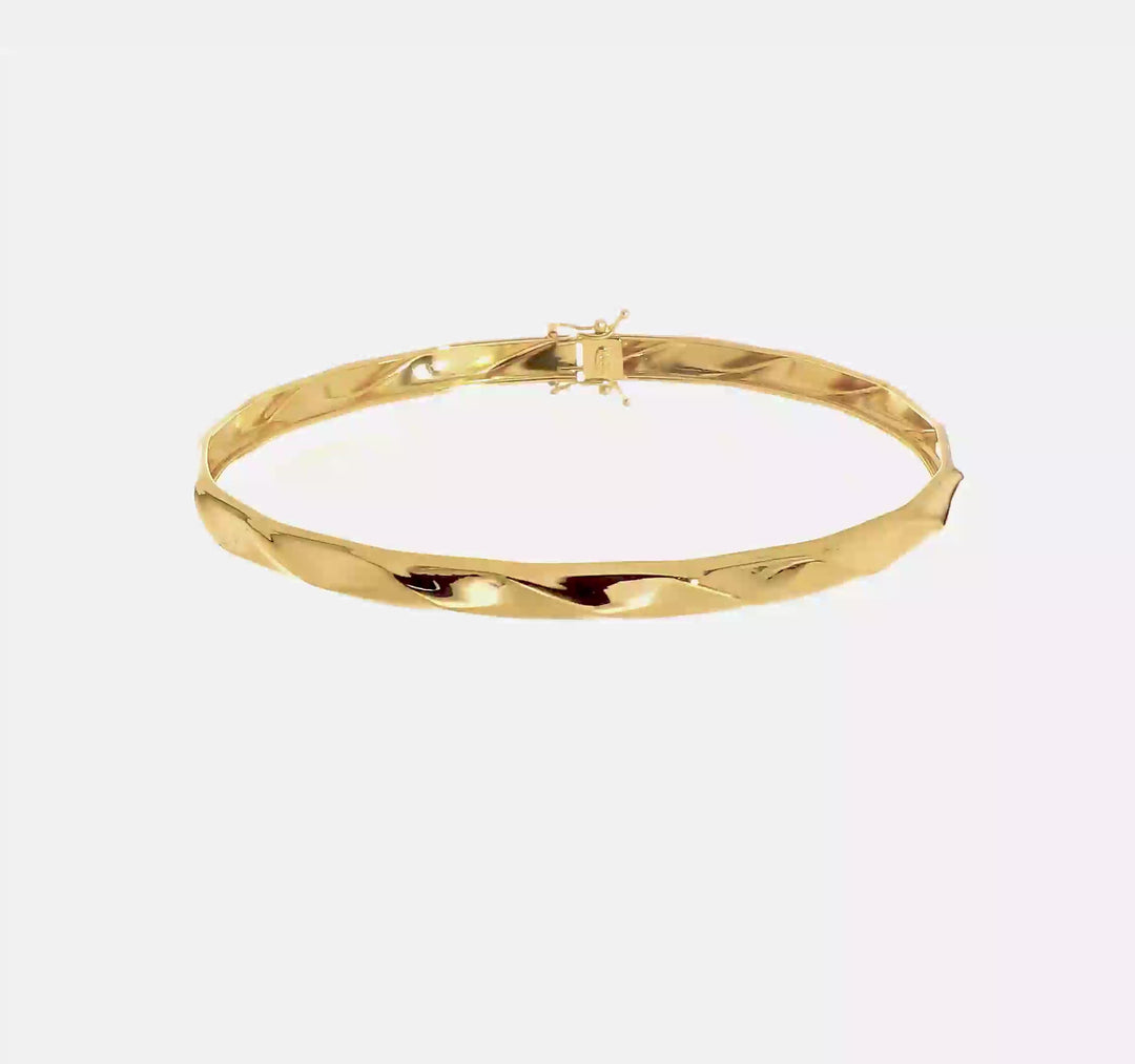 Pulsera Rígida Flexible de Oro Amarillo de 14k con Diseño Torcido y Acabado Pulido