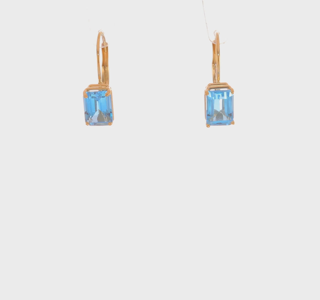 Pendientes de Oro Amarillo de 14k con Topacio Azul Suizo Cortado en Esmeralda de 7x5mm y Cierre LeverBack